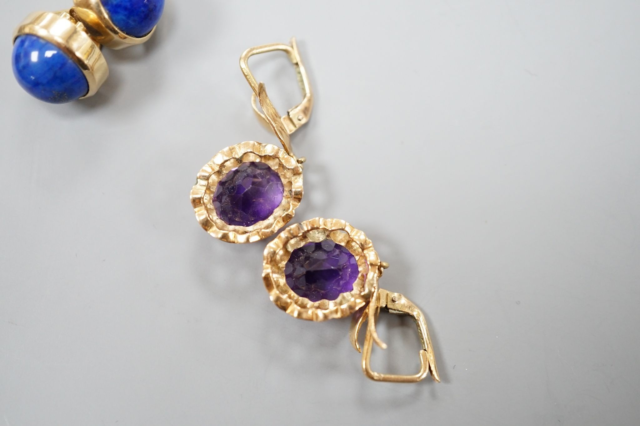 A modern pair of 14k yellow metal and amethyst set drop earrings, 29mm and a similar pair of lapis lazuli set earrings, gross weight 13.9 grams.